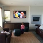 Kid watching television in the living room