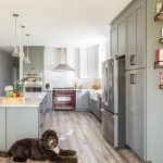 A modern kitchen design with a blend of light and dark elements