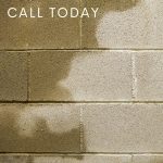 wet bricks with a call today text on upper left