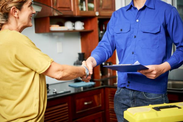 female client shaking hand of a contractor