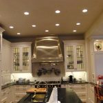 modern kitchen with many round ceiling lights