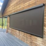 Awning mounted on the exterior wall of a house