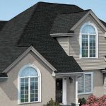 large house with new roofing, siding, and windows