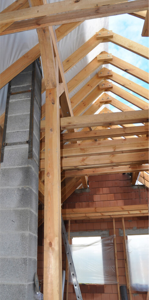 img - building-new-modular-pumice-stone-chimney-inside-of-attic-room-and-roof-construction-interior