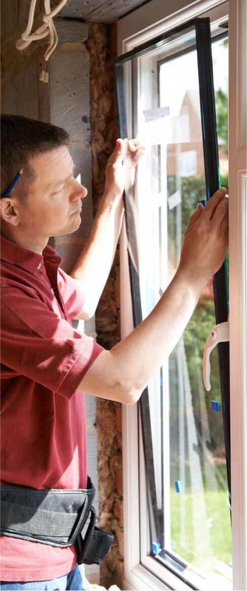 img - construction-worker-installing-new-windows-in-house
