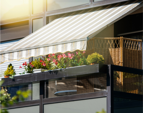 img - french-balcony-with-beautiful-awning-and-flowers