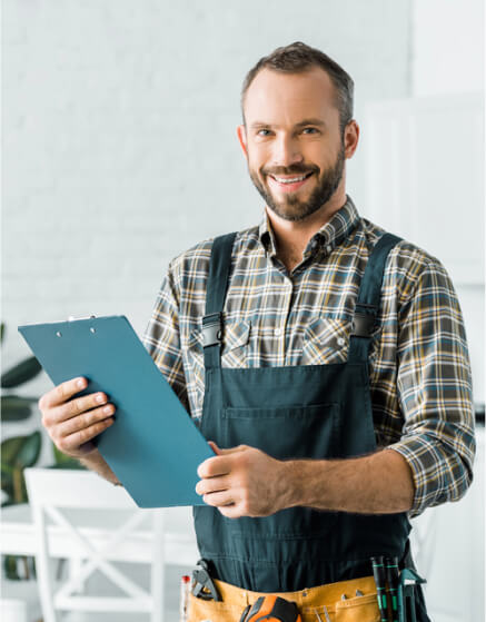 img - smiling-handsome-plumber-holding-clipboard-looking-camera-kitchen