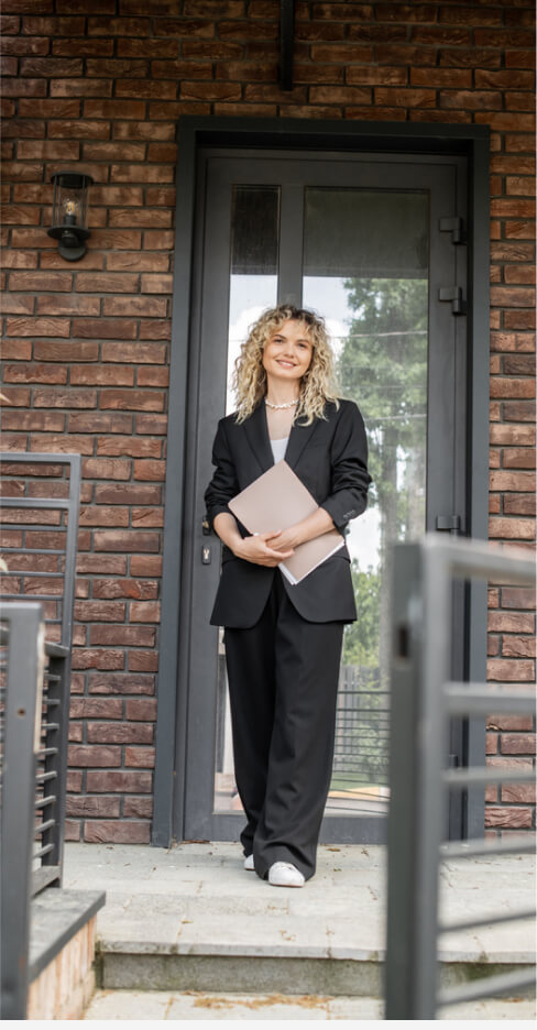 img - stylish-confident-realtor-standing-folder-new-house-city