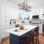 A kitchen with a prominent kitchen island