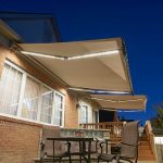 awnings with lights covering a portion of the front porch