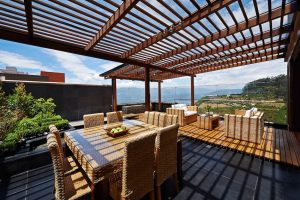 Outdoor deck with a pergola and a mountain view