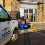 All Pro Restoration service van in front of International Bank