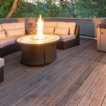 An outdoor living space with a round firepit