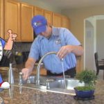 Technician fixing the sink