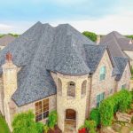 installed roofing for a huge castle-like house