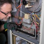 Technician fixing a wire