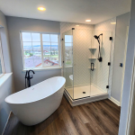 Shower and tub beside the window