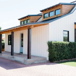 modern home with painted white exterior with sleek black trim