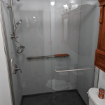 shower area with glass sliding door